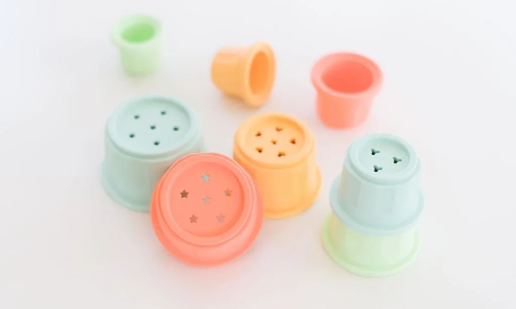 How to Use Stacking Cups for Baby Development: Montessori Activities for 6-12 Months