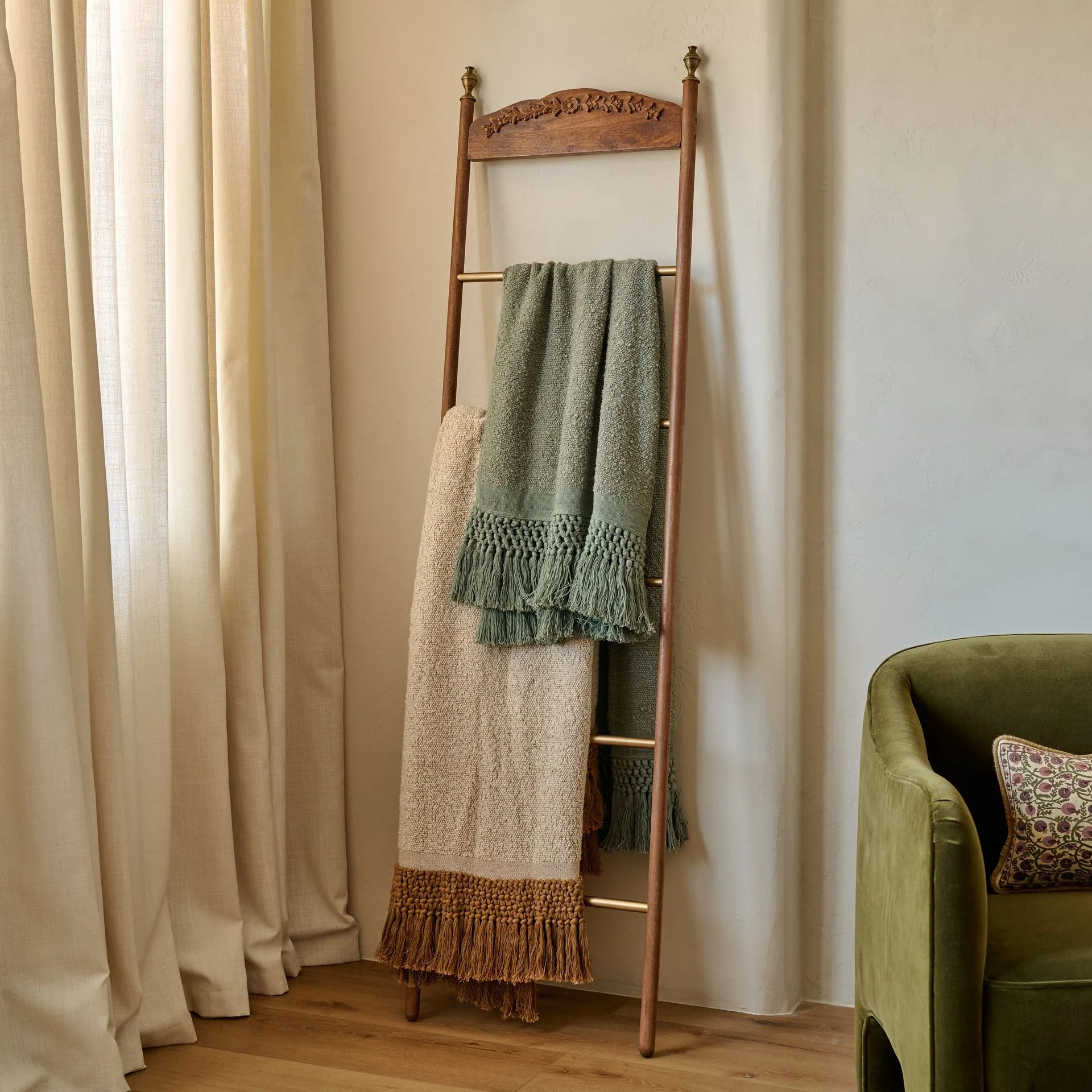 How to Style the Gloria Carved Wood and Brass Decorative Ladder in Your Living Room