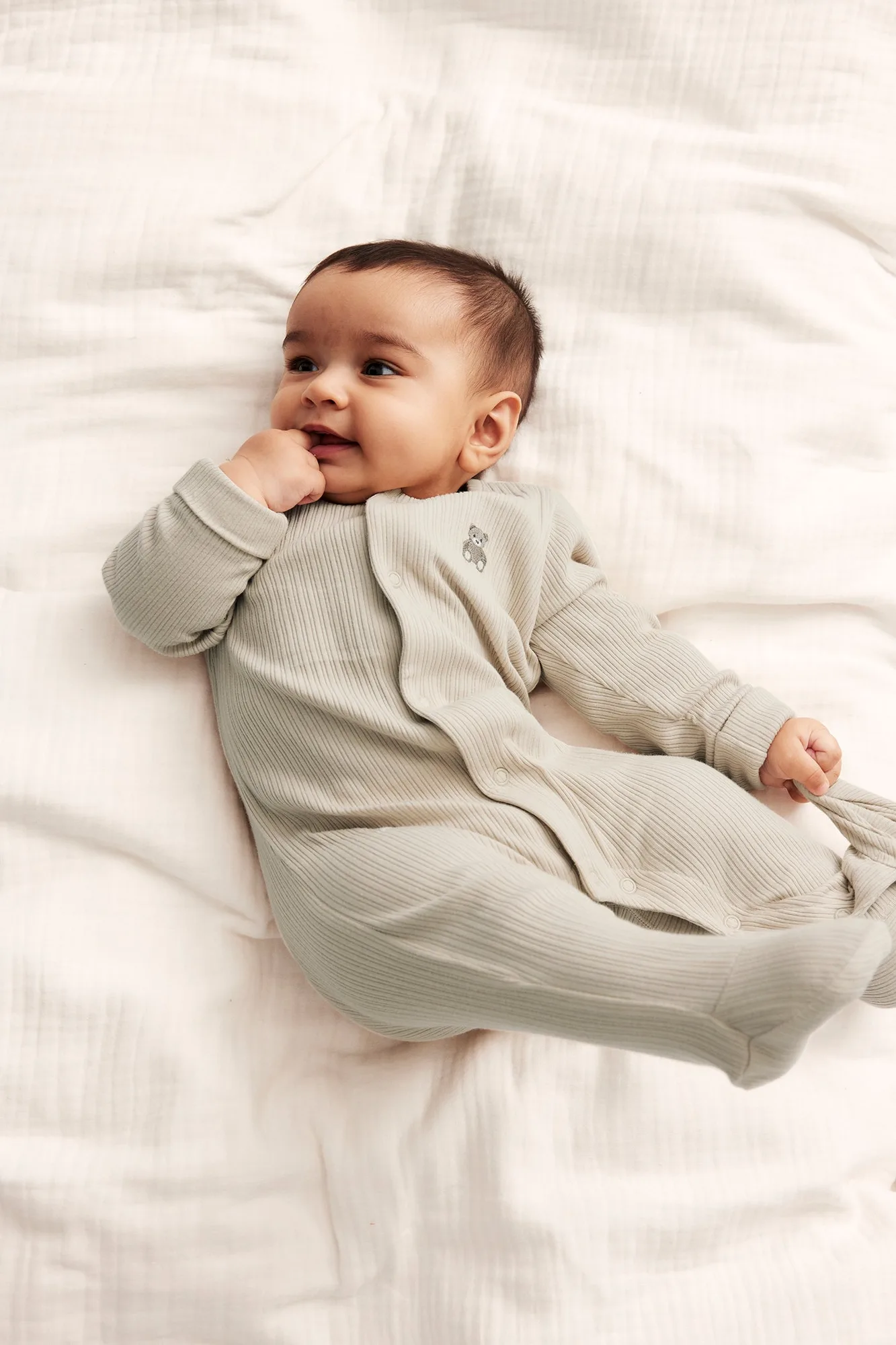 Baby beige ribbed sleepsuit
