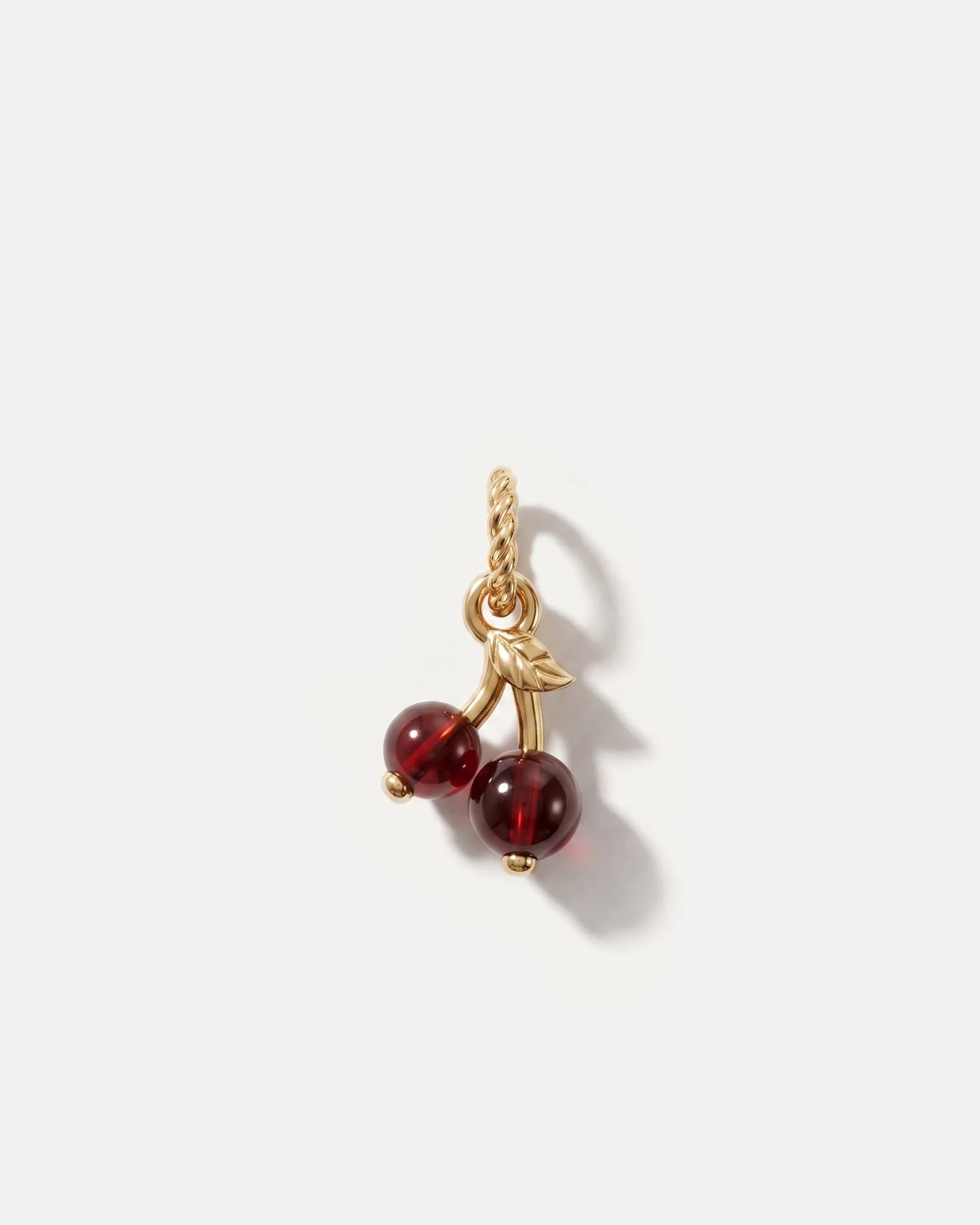Seashell Charm vs. Garnet Cherry Charm: A Detailed Comparison of Two Unique Charms