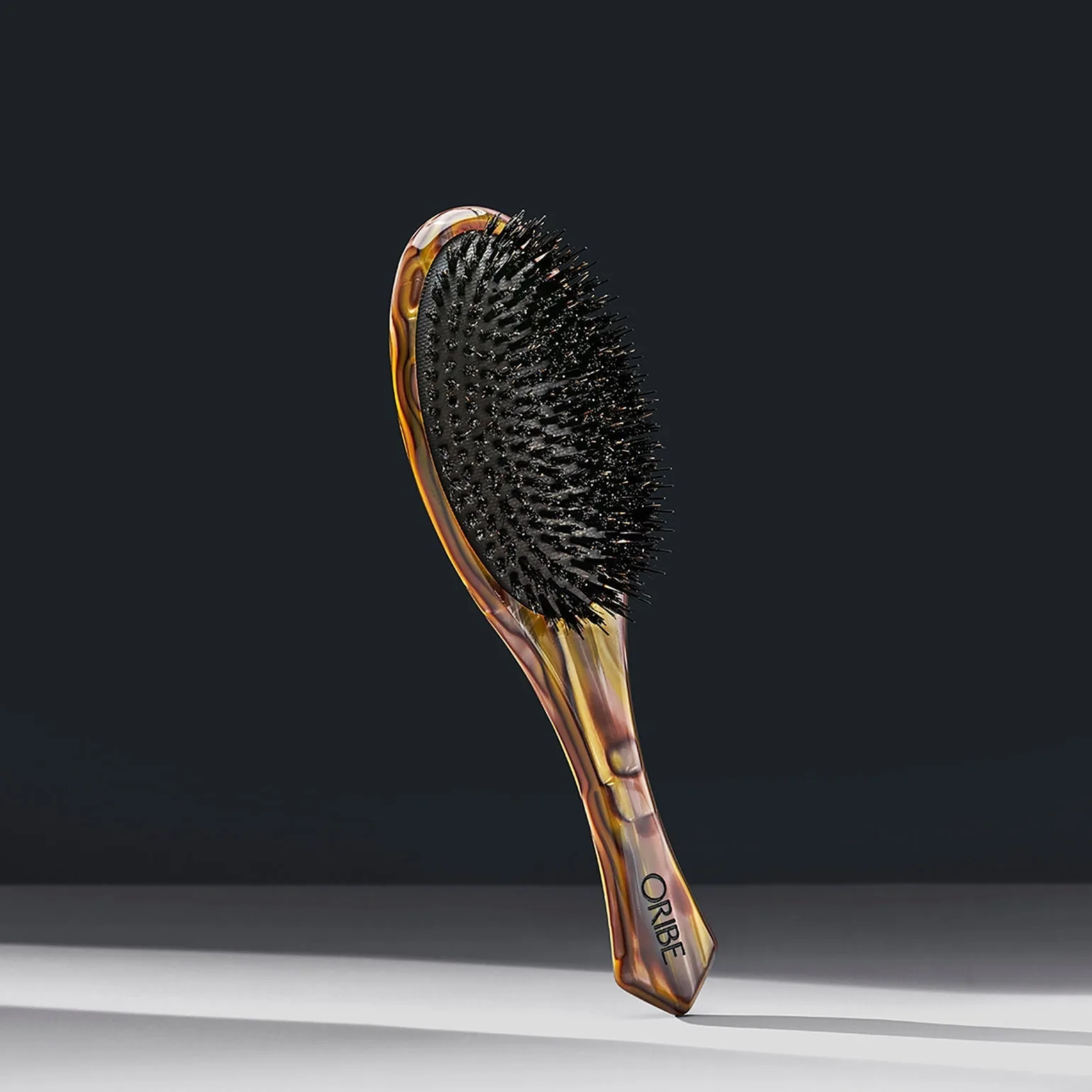 Oribe Italian Resin Flat Brush vs. Round Brush: Which One Do You Need?
