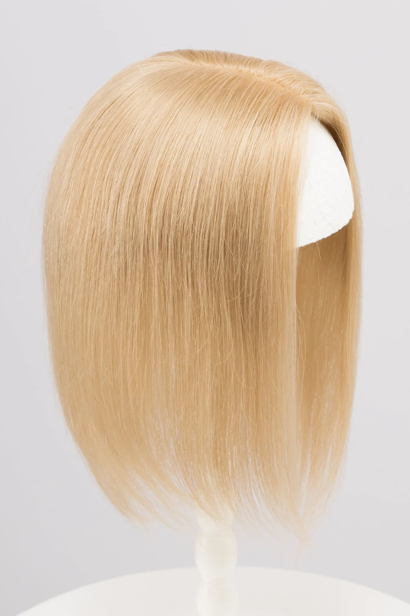 Come acconciare un Mono Top Topper per una chioma naturale