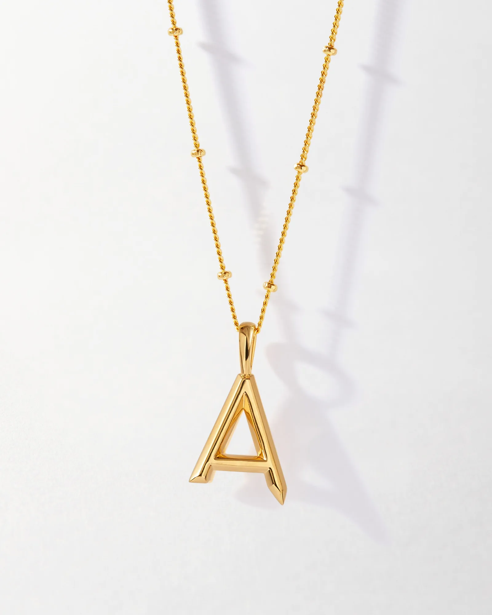 Mini Initial Pendant Review: Gold vs. Silver – Which Shines for You?