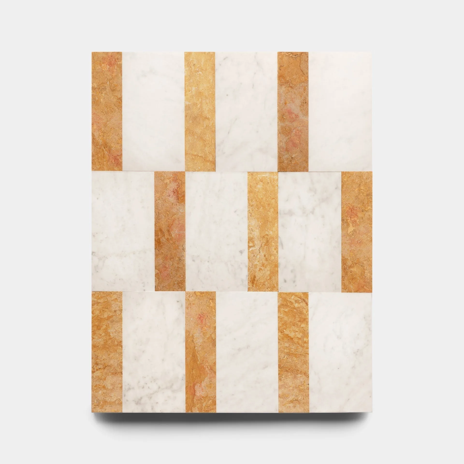 Carrara Marble vs. Grigio Carnico: A Tile Comparison