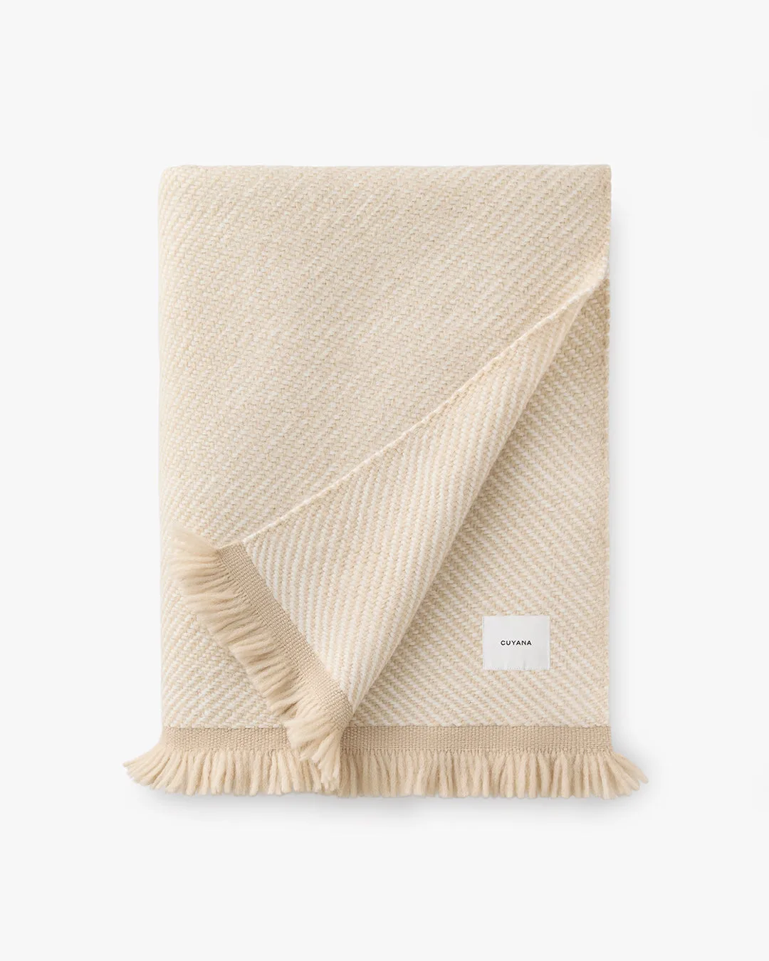 Comment superposer une couverture en alpaga bicolore pour un style cosy