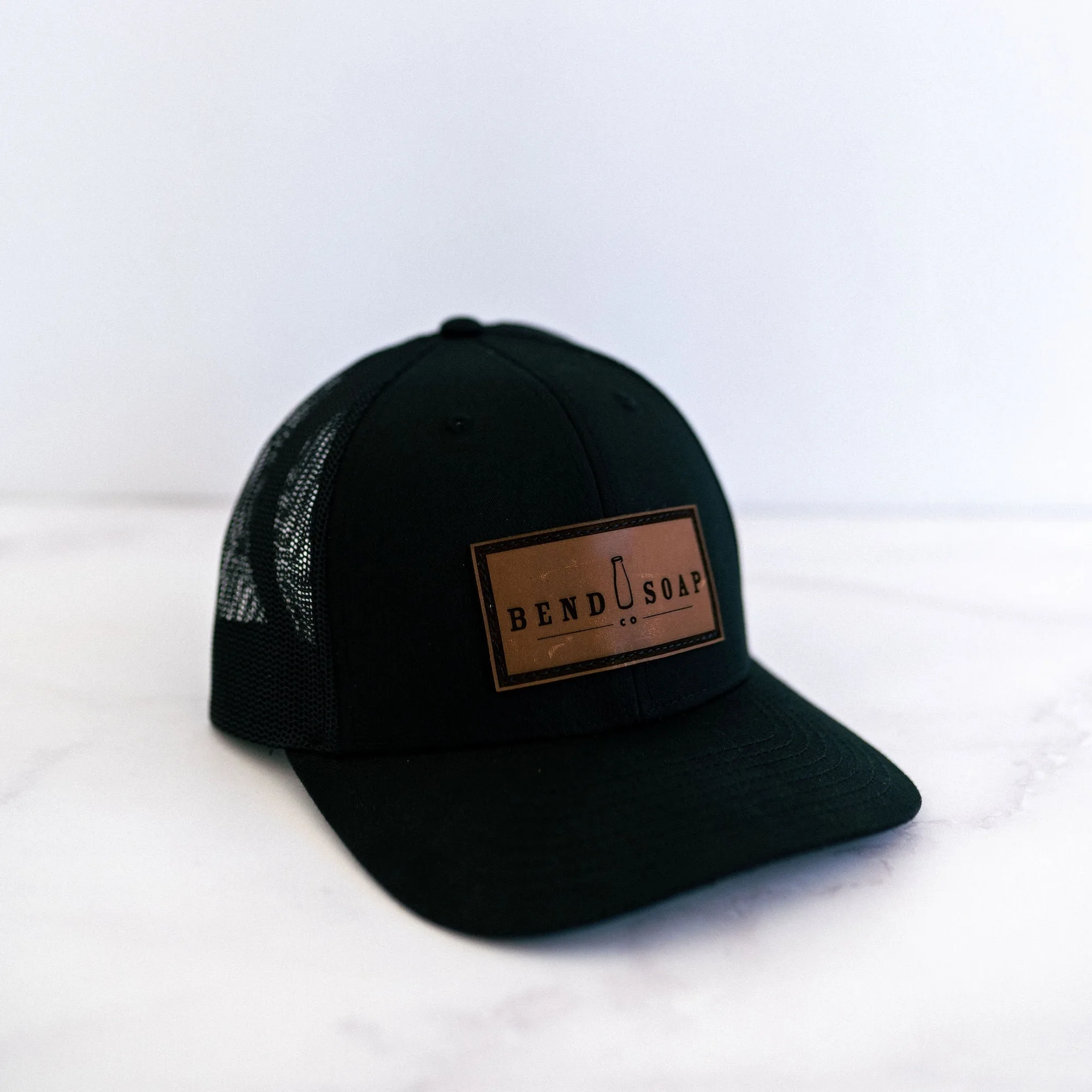 How to Style the Black Trucker Hat With Leather Panel