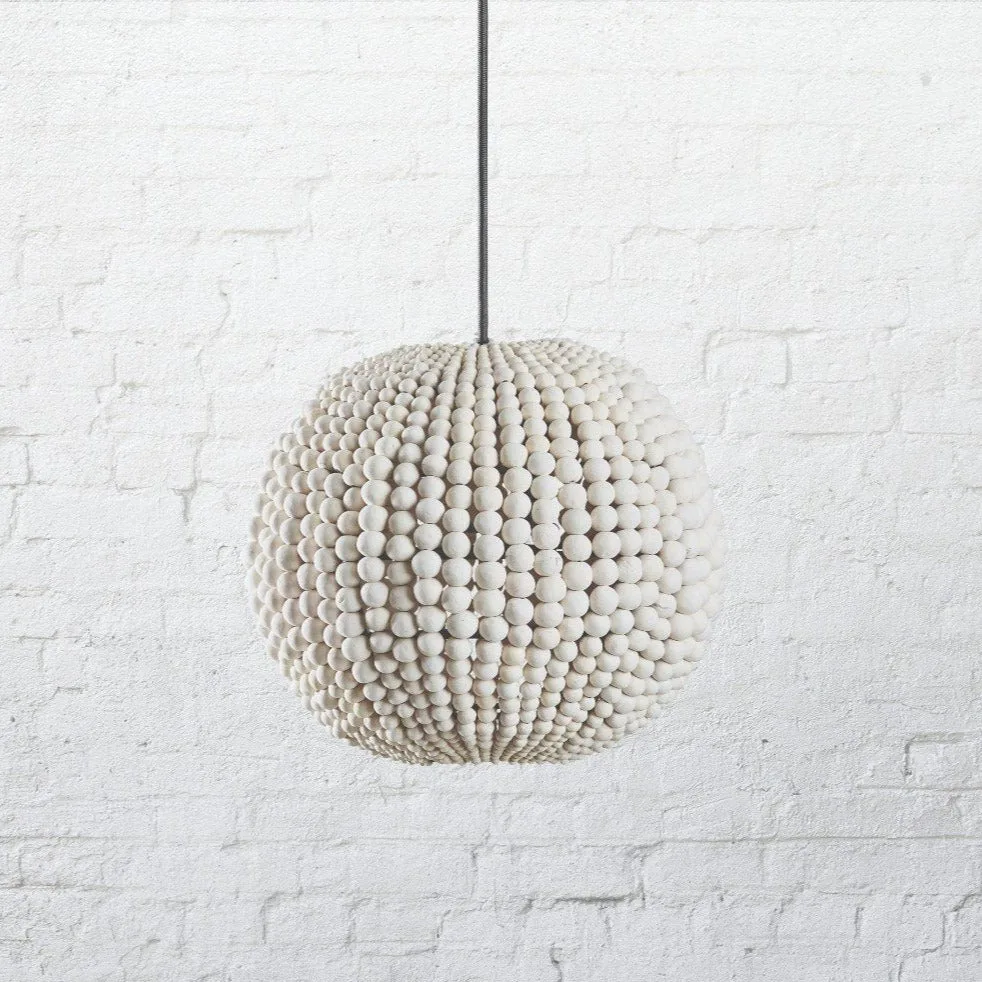How to Pair Handmade Clay Bead Chandeliers with Moroccan Rugs for a Global Boho Look
