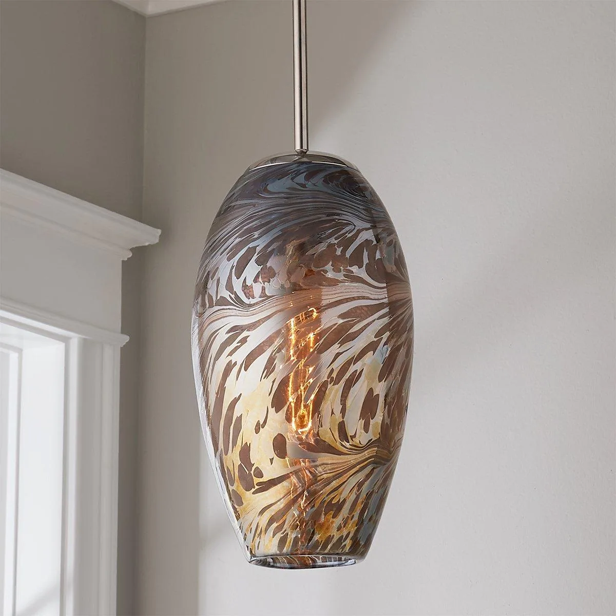 Calypso Swirl Pendant vs Mirrored Swirl Pendant: Which Swirl Design Fits Your Space?