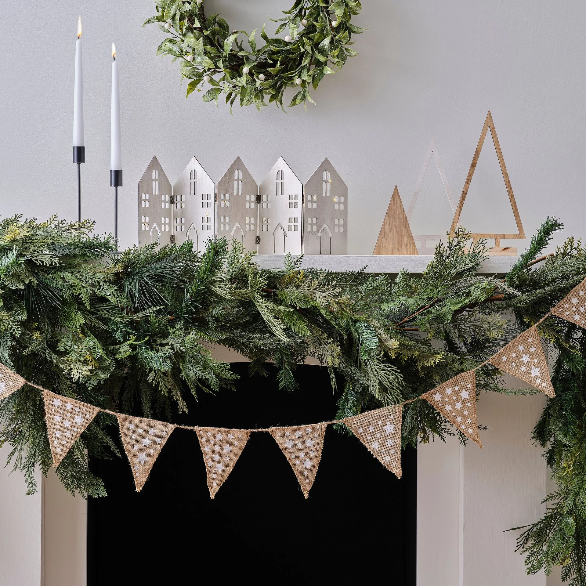 How to Style a Christmas Mantelpiece with Garlands, Stockings, and Candles