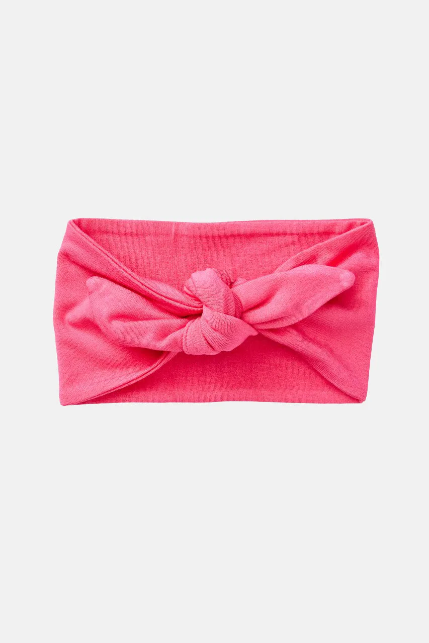 Abbinare una fascia con fiocco ai look del bebè