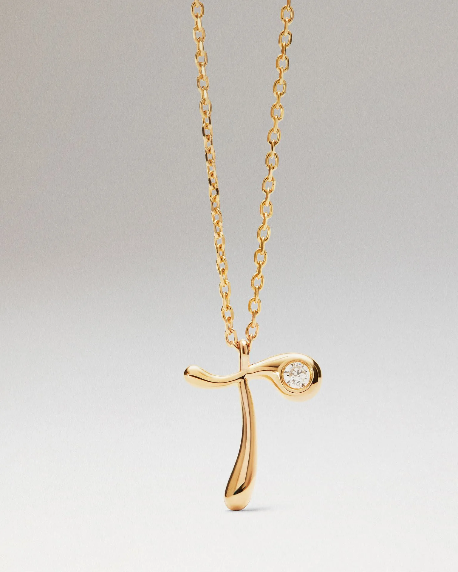 How to Style Layered Necklaces with a Diamond Initial Pendant