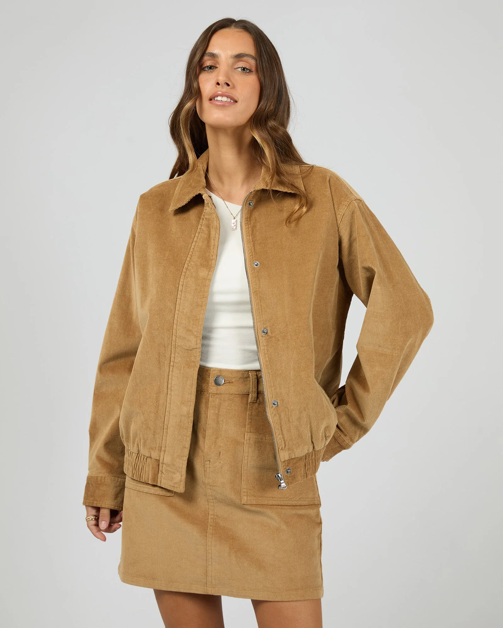 How to Layer a Cord Bomber Jacket Over Knits and Dresses