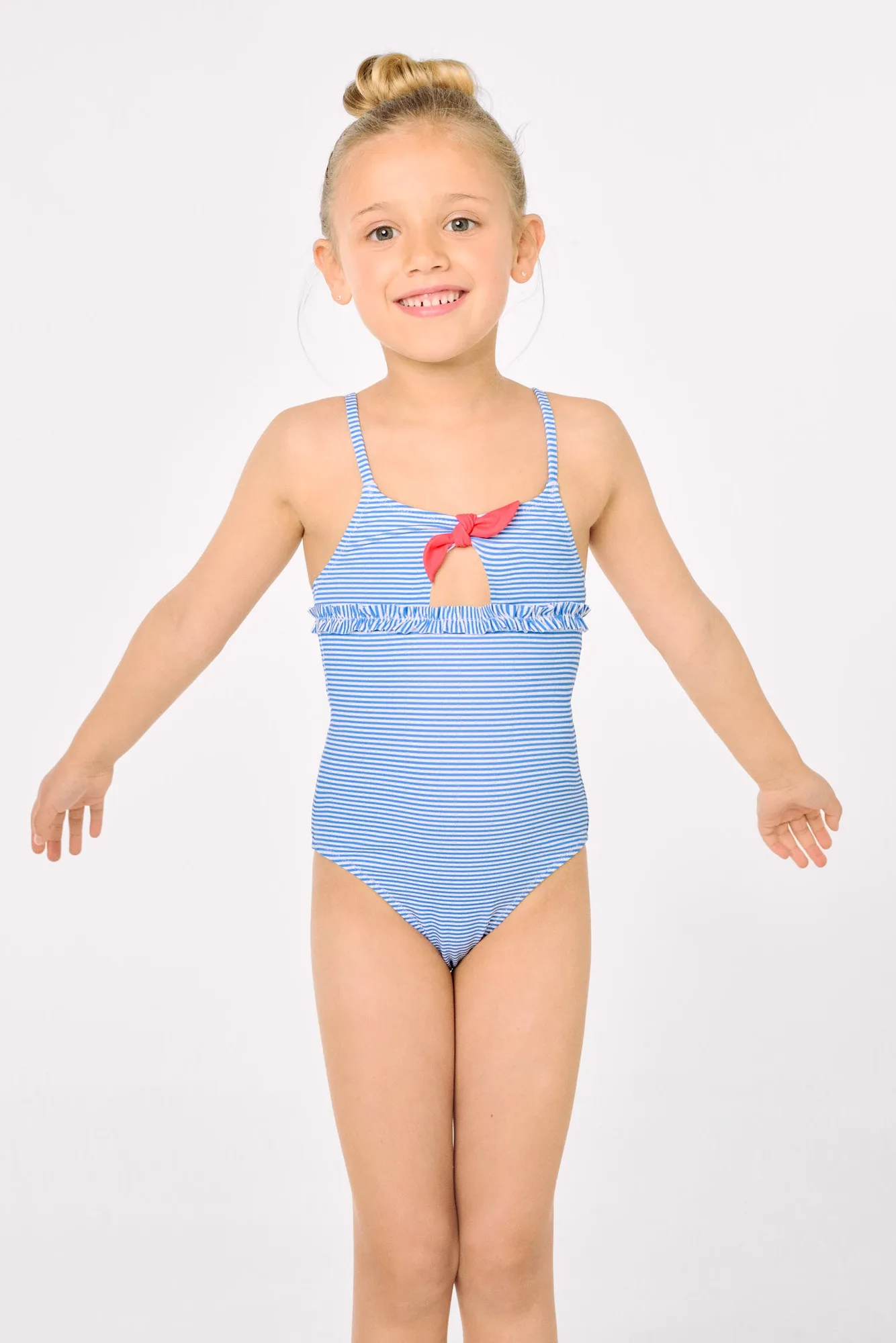 Bañador niña detalle lazo y volantes estampado rayas