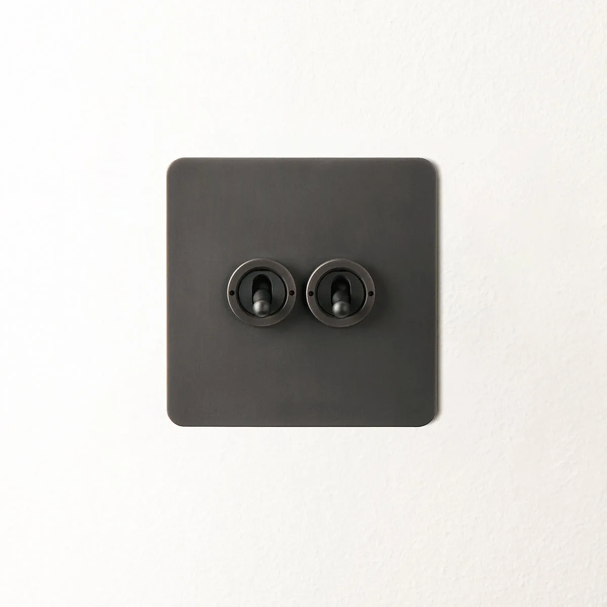 Lucian two gang intermediate toggle switch in bronze