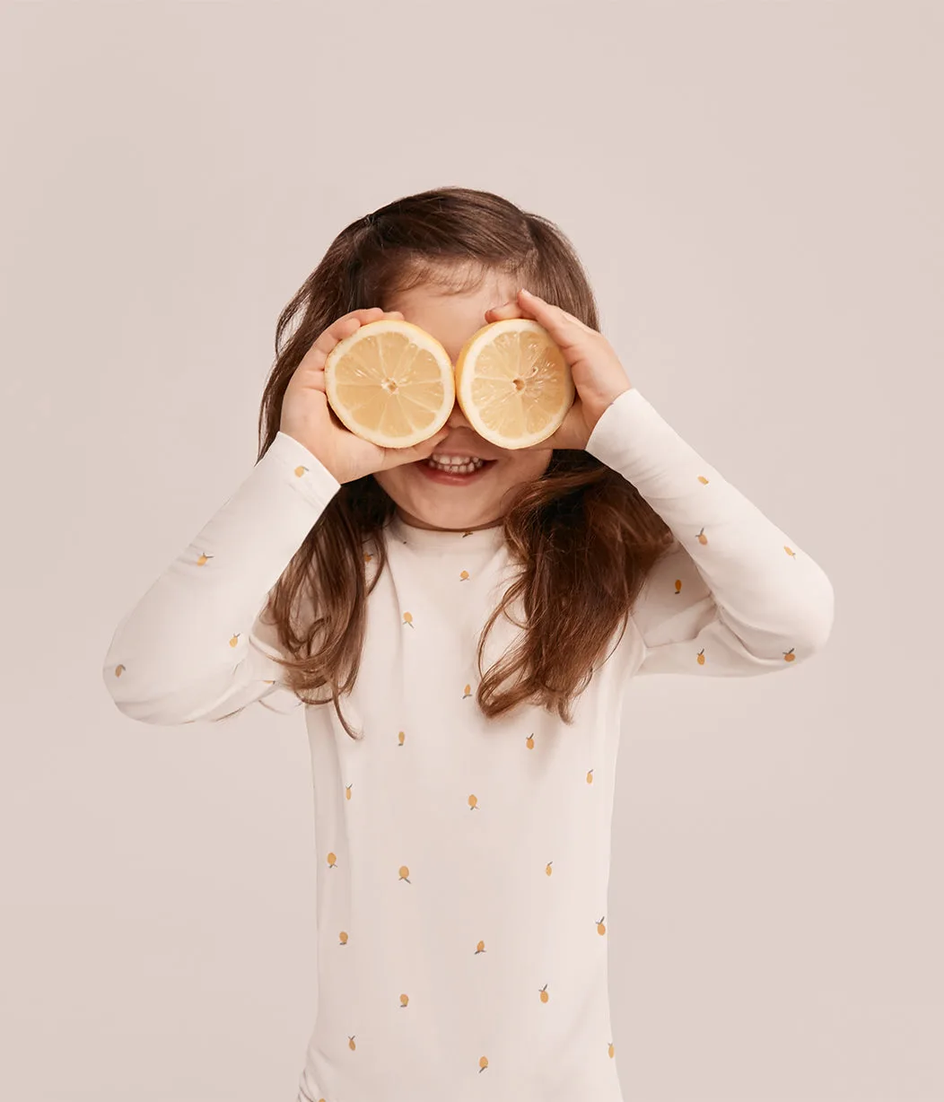 Pijama infantil de manga larga: guía de ajuste y tejido
