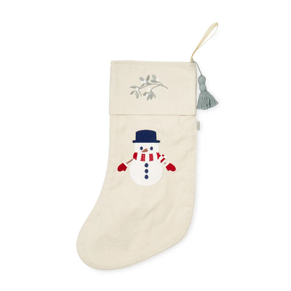 Een GOTS sneeuwmankous stylen voor de eerste kerst van de baby