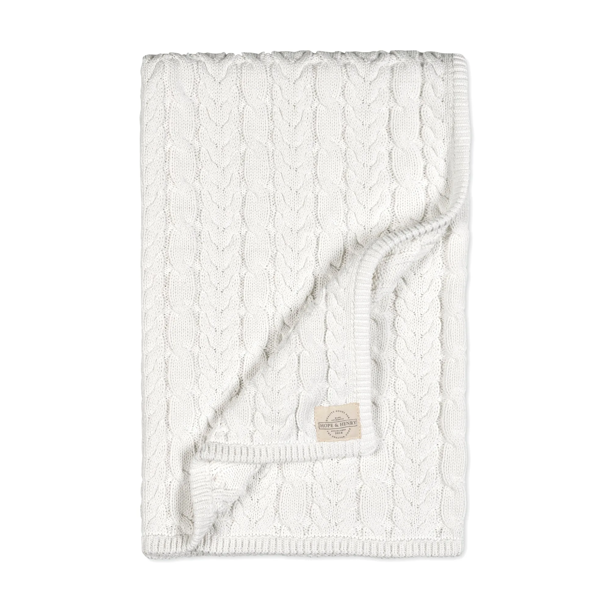 Entretenir une couverture bébé en maille torsadée bio